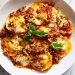If your lasagna is very close to the top of your casserole dish, place a baking sheet underneath the casserole dish to catch any splatters of sauce, as it gets hot and bubbly toward the end Recipe