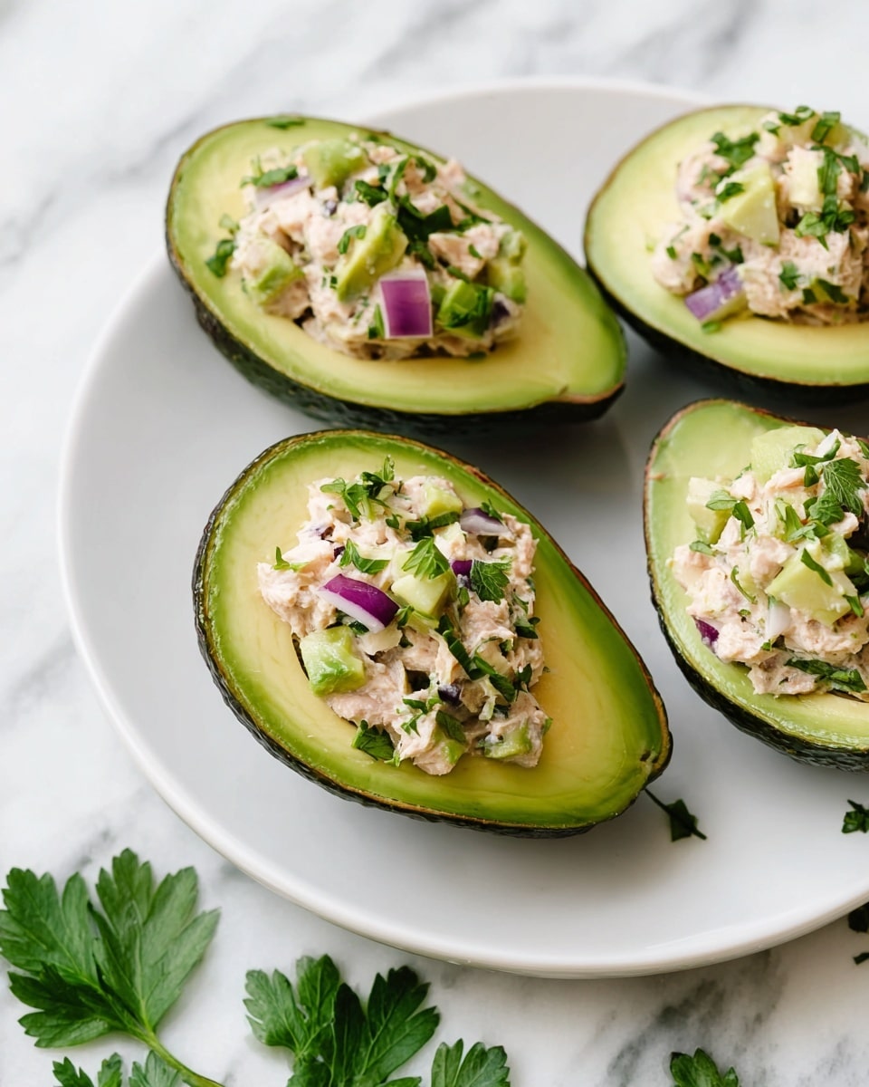 The image shows two clear glass bowls on a white marbled surface, each with different stages of tuna salad. On the left bowl, there are five main layers: at the bottom is a light brown flaky tuna, next to it are three separate piles of diced vegetables—green celery, dark purple onion, and bright green chopped chives. On top of the tuna are thick dollops of pale yellow mustard and creamy off-white mayonnaise. A silver spoon is placed inside the bowl, leaning to the right. On the right side, the second bowl contains the fully mixed tuna salad with all ingredients blended together, showing light brown tuna bits now mixed with small visible green, purple, and cream-colored specks. Another silver spoon is resting inside this bowl, slightly angled to the right as well. Photo taken with an iphone --ar 4:5 --v 7